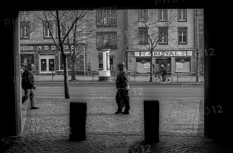 Germany, Merseburg, 15.01.1992, house passage, advertising pillar, street, citizen