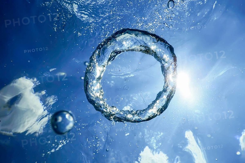 Underwater Bubble Ring Ascends towards the Sun