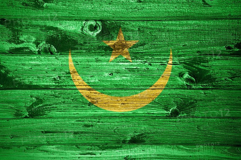 Mauritania flag on wooden planks background wood flag
