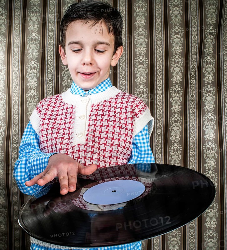 Child hold lp. Vontage clothes