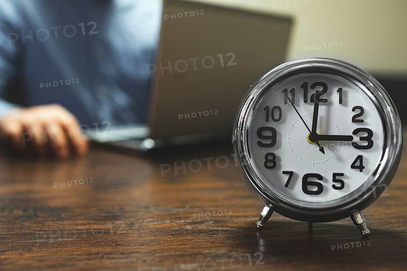 The clock shows three o'clock in the afternoon. Working hours are in full swing