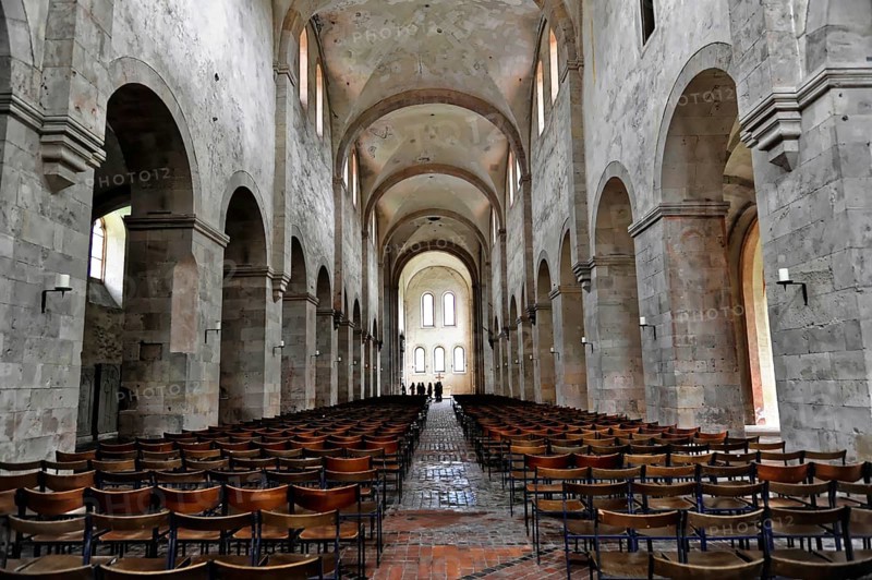 Interior view of the central nave, basilica, monastery church, founded in 1136, Eberbach Monastery, Eltville am Rhein, Rheingau, Hesse, Germany, Large nave with long rows of seats and high vaulted ceiling, Eltville am Rhein, Rheingau, Hesse, Germany