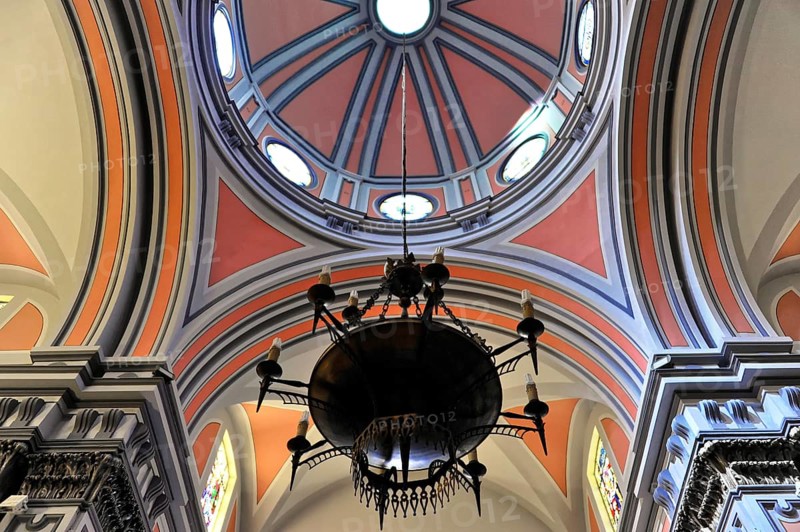 La Merced or Church of Our Lady of Mercy, view of a richly decorated ceiling with dome and a large candelabra, Ronda, Malaga province, Andalusia, Spain