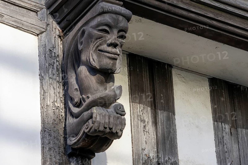 Totnes, Devon, UK, January 16. View of a wooden gargoyle in Totnes, Devon on January 16, 2024