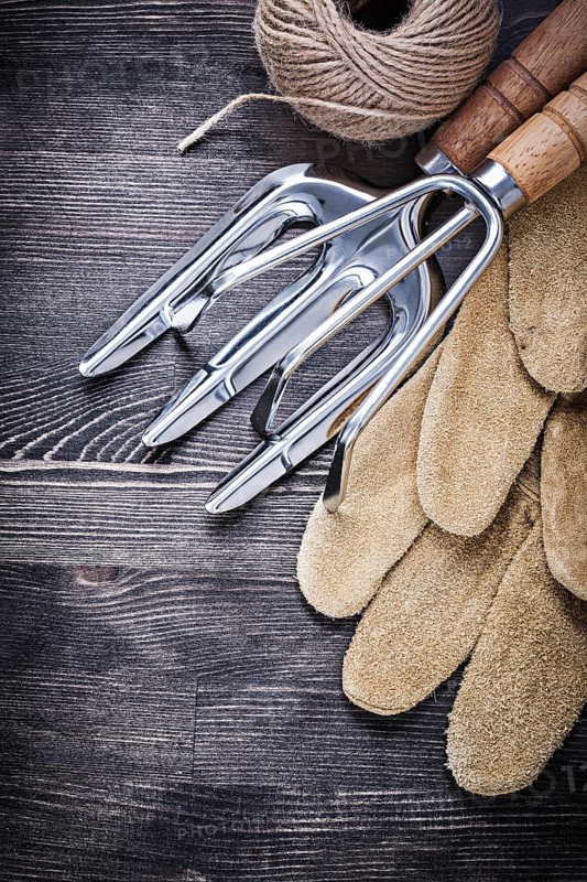 Trowel fork rake leather gloves hank of string agriculture concept