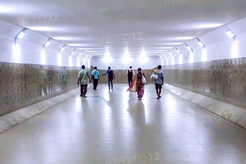 People walking in underpass, Lake Town, Kolkata, West Bengal, India, Asia