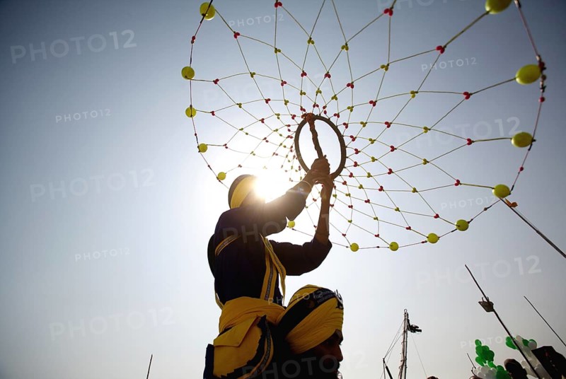 Young Nihangs Sikh warrior performing traditional martial art Gatka consecration perpetual Guru Granth Sahib, Nanded
