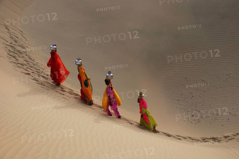 Girls climbing dune, Khuhri, Jaisalmer, Rajasthan, India