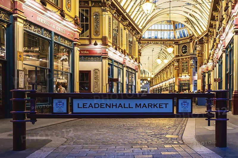 London Leadenhall Market entrance showcases stunning Victorian architecture, warm lighting, and historic charm