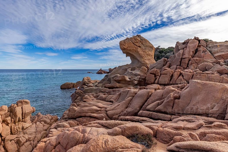 Coastal landscape with bizarre red rocks and sea view, Spiaggia di Cala E'Luas, Ogliastra, Sardinia, Italy