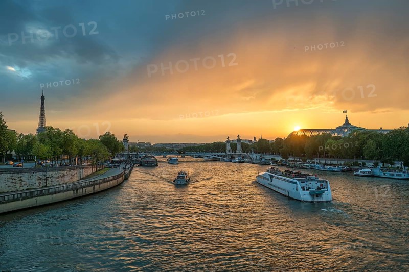 Paris France, city skyline sunset at Seine River with Pont Alexandre III bridge and Grand Palais