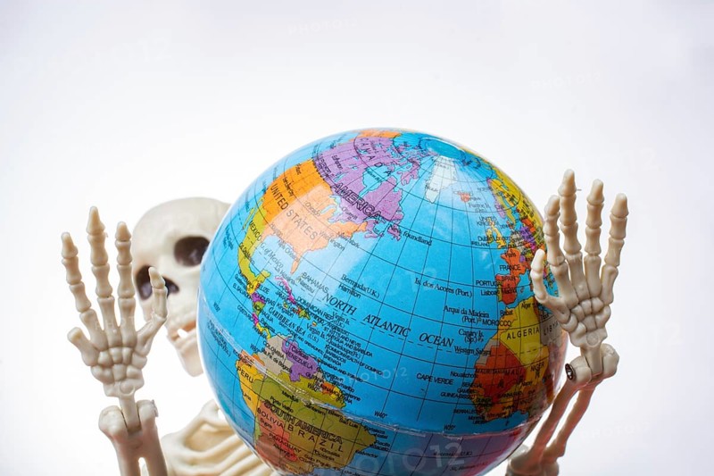 The earth in a skeleton hand