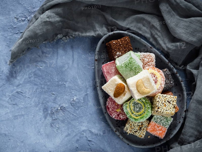 Turkish delight on blue concrete background