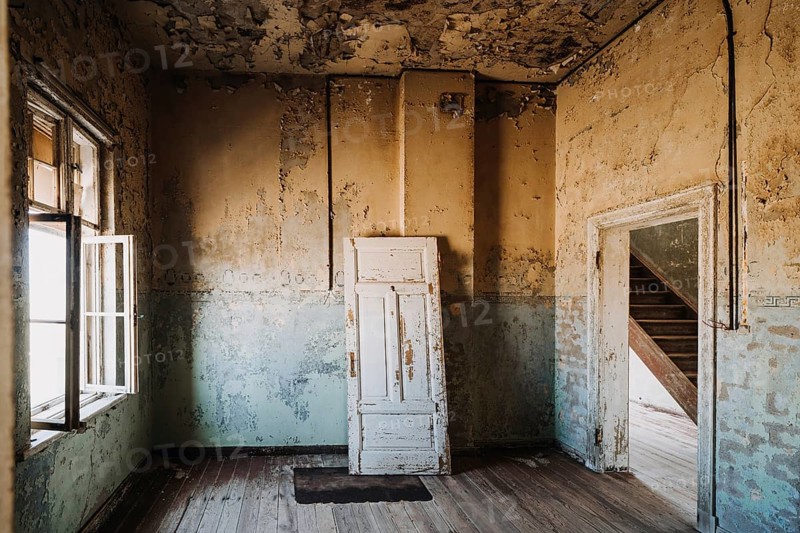 Concept photo of home renovation with old abandoned house and plenty of copyspace