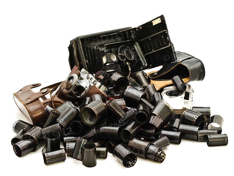 Retro Photo Accessory With Many Films And Vintage Cameras Against The White Background Daugavpils, Latvia