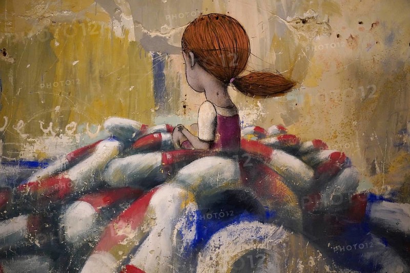 MAUSA VAUBAN, Museum of Urban Art and Street Art, Neuf-Brisach Fortress, France, Europe, Rear view of a girl with auburn hair in an artistic painting surrounded by pastel colours