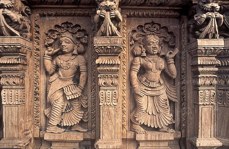 Decorative pieces of women wooden carving statues in old temple chariot at Madurai, Tamil Nadu, India