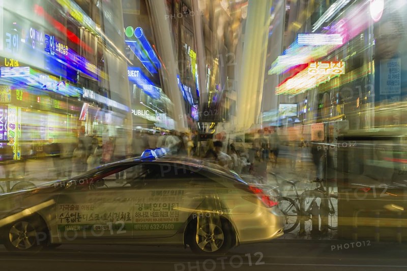 September 5, 2018. Daejeon, South Korea: Night zoom of taxi driving in front of busy business district downtown