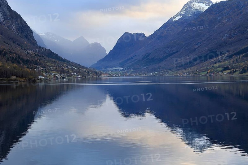 View of the Innvikfjorden near Loen in Norway. The landscape is reflected in the water