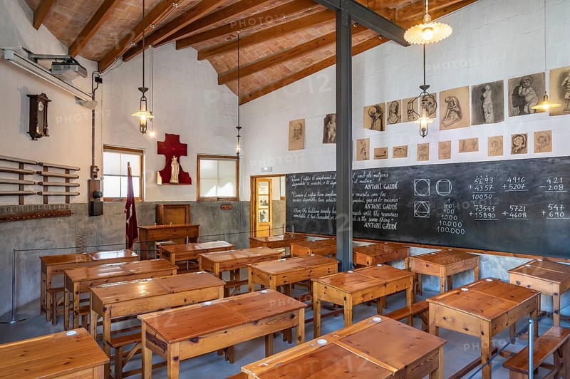 Classroom around 1900 with wooden desks and slate board with maths problems in the school for the children of the construction workers of the World Heritage Site church La Sagrada Familia by Antoni Gaudi, Barcelona, Catalunya, Spain
