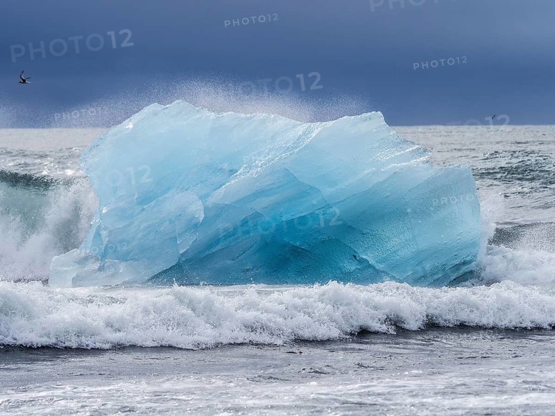 Diamond Beach, iceberg in the surf, near Jökulsarlon glacier lagoon, Vatnajökull National Park, Hornafjörður, South Iceland, Iceland