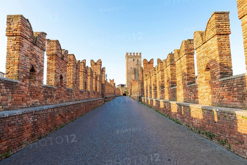 Verona, Italy. Castelvecchio bridge on Adige river. Old castle sightseeing at sunrise