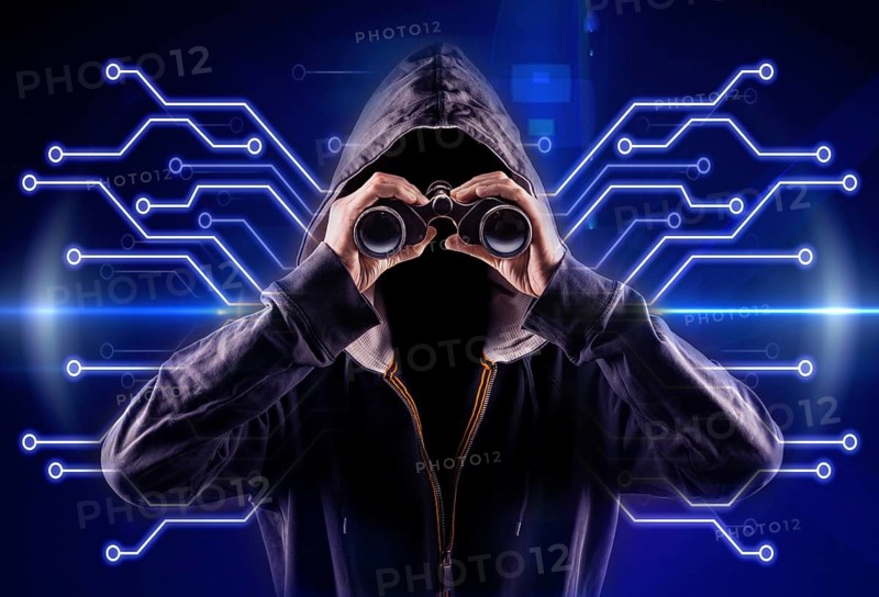 picture of a hacker with a spyglass
