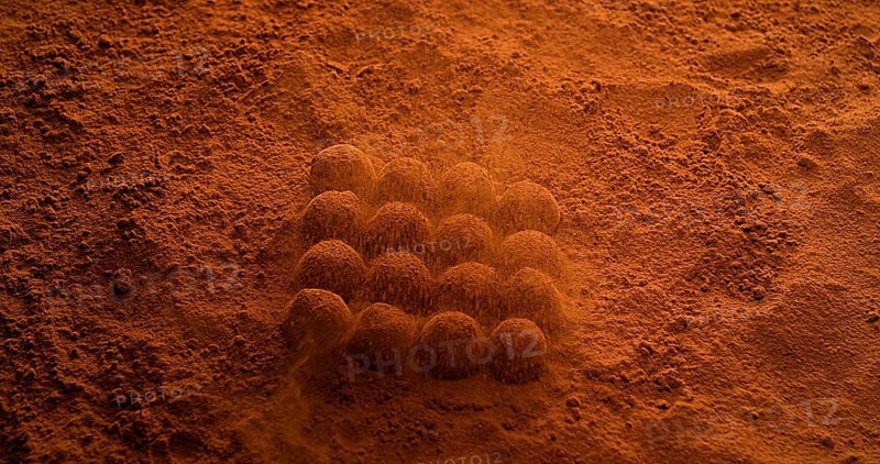 Chocolate Powder falling on Chocolate Truffles