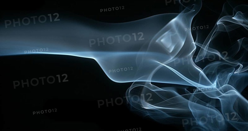Smoke of Cigarette rising against Black Background