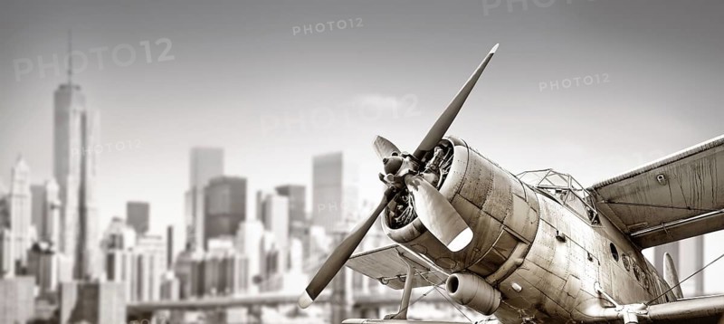 biplane against the skyline of new york