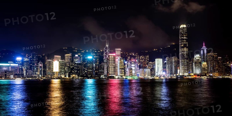 HONG KONG, CHINA - SEPTEMBER 27 2024: Night time view of Hong Kong Island and Victoria Harbour from Kowloon on a autumn evening, Hong Kong, China