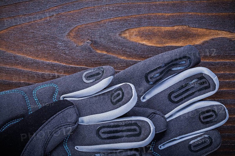 Working safety gloves on wood board gardening concept