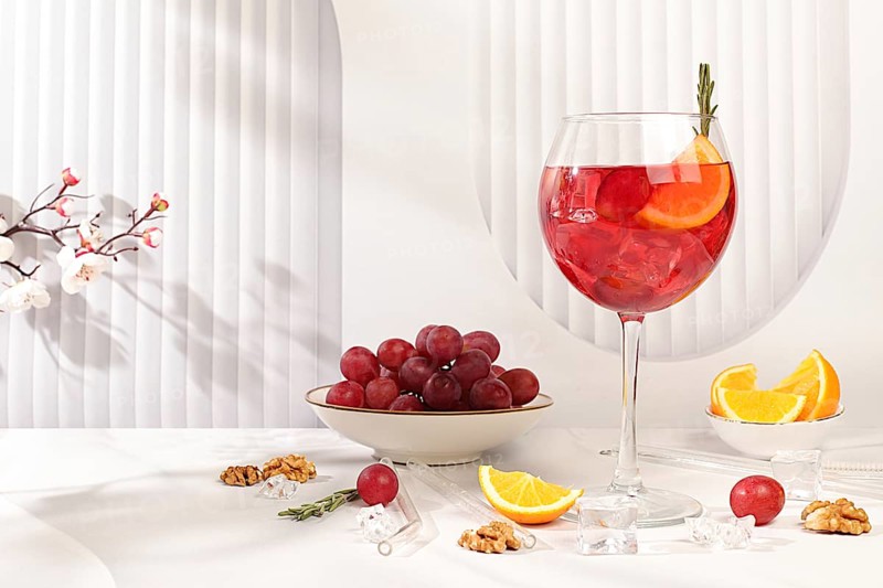 Royal lemonade cocktail with tequila, gin, rum, ice and grapes, bar and party concept, restaurant and cafe advertising card, elegant minimal background, selective focus