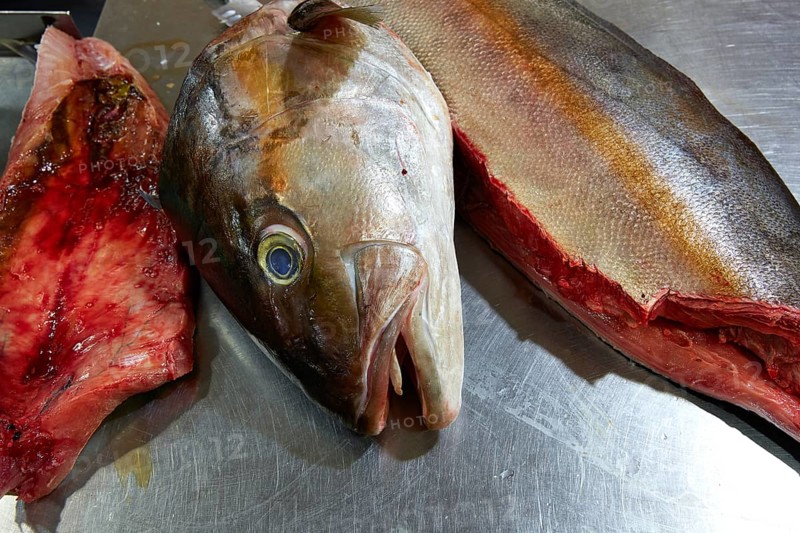 Amberjack fish head fillet process in stainless steel kitchen
