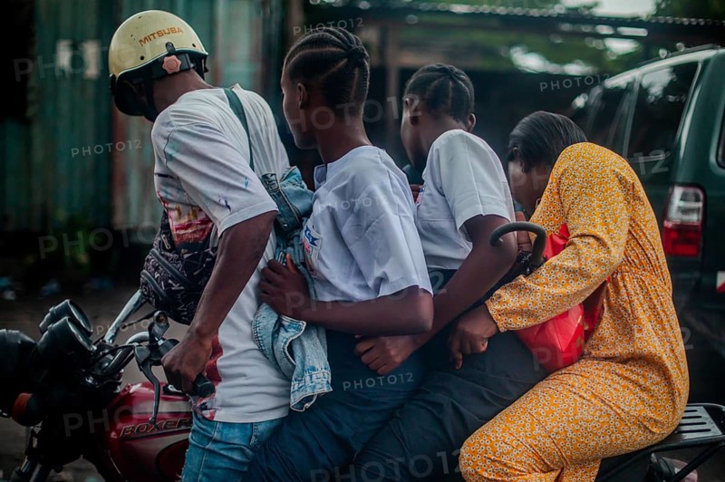 Four on a motorbike, everyday life in Kinshasa, Democratic Republic of the Congo, DR Congo