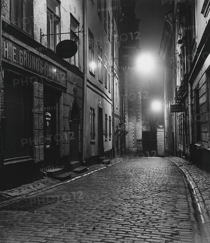 In the 1950s. An evening view of a street with old houses