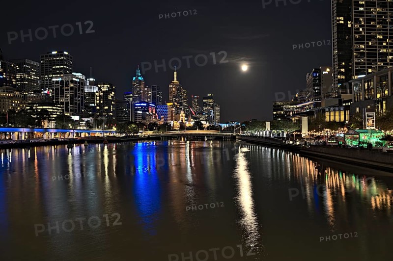 The skyline of Melbourne and the Yarra river at nighttime when there was an event of supermoon