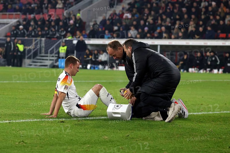 Joshua Kimmich (FC Bayern Munich) has to be treated and substituted after a blow to the foot during the UEFA Nations League match: Germany v Bosnia-Herzegovina, Freiburg, Germany / Germany