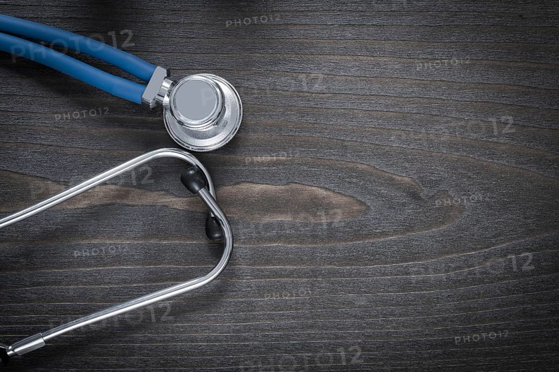 Wooden board with diagnostic medical stethoscope copy space image medicine concept
