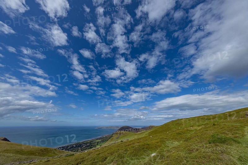 Vast rolling countryside with green meadows and sea views on the edge of Snowdonia National Park, Penmaenmawr, Dwygyfylchi, Caernarfonshire, Conwy County Borough, Wales, United Kingdom