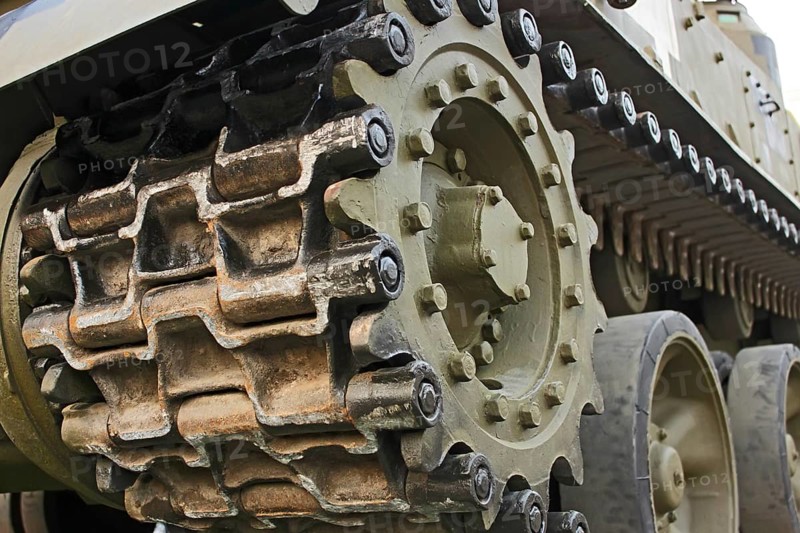 Part of the undercarriage of tracked military equipment, close-up
