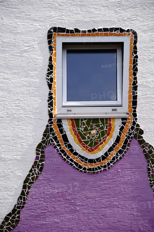 The close-up of a window which was decorated all around with glass splinters