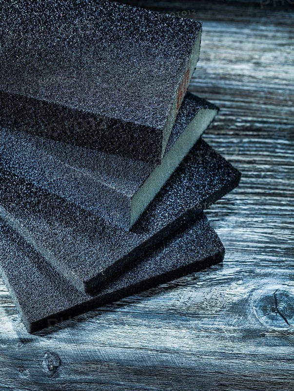 Polishing sanding blocks on vintage wooden board