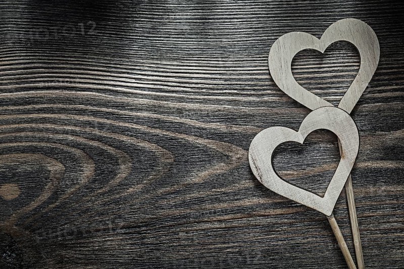 White wooden hearts on wood board holidays concept