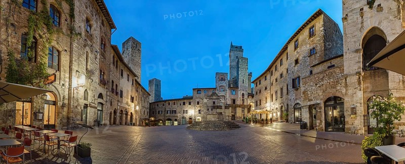 Panoramic view of famous Piazza della Cisterna in the historic town of San Gimignano on a morning, Tuscany, Italy
