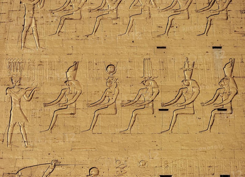 Hieroglyphic carvings on the exterior walls of an ancient egyptian temple