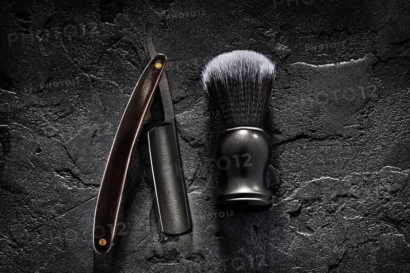 Black Barber Tools. Shaving Brush And Opened Straight Razor With Classic Wooden Handle On Abstract Dark Background