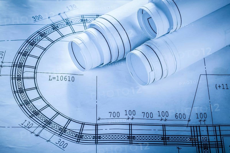 Rolled construction drawings on blueprint
