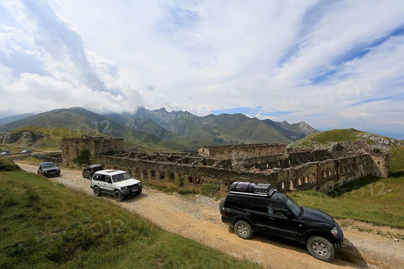 Off-road vehicle tour on the former military track on the French-Italian border Ligurian border ridge road, ruins of the former barracks at Col de Tende, Departement Alpes-Maritimes, France, Italy