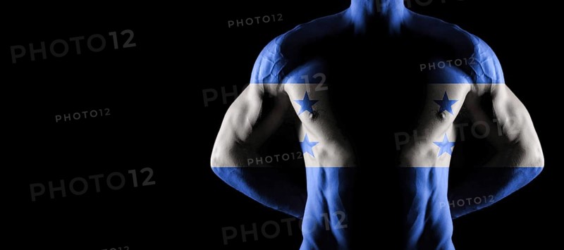Honduras flag on muscled male torso with abs, black background